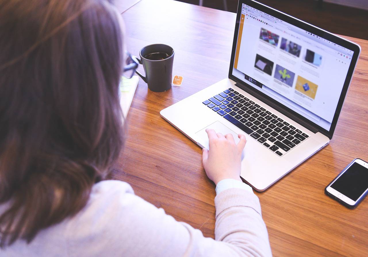 image of a woman working on a computer
