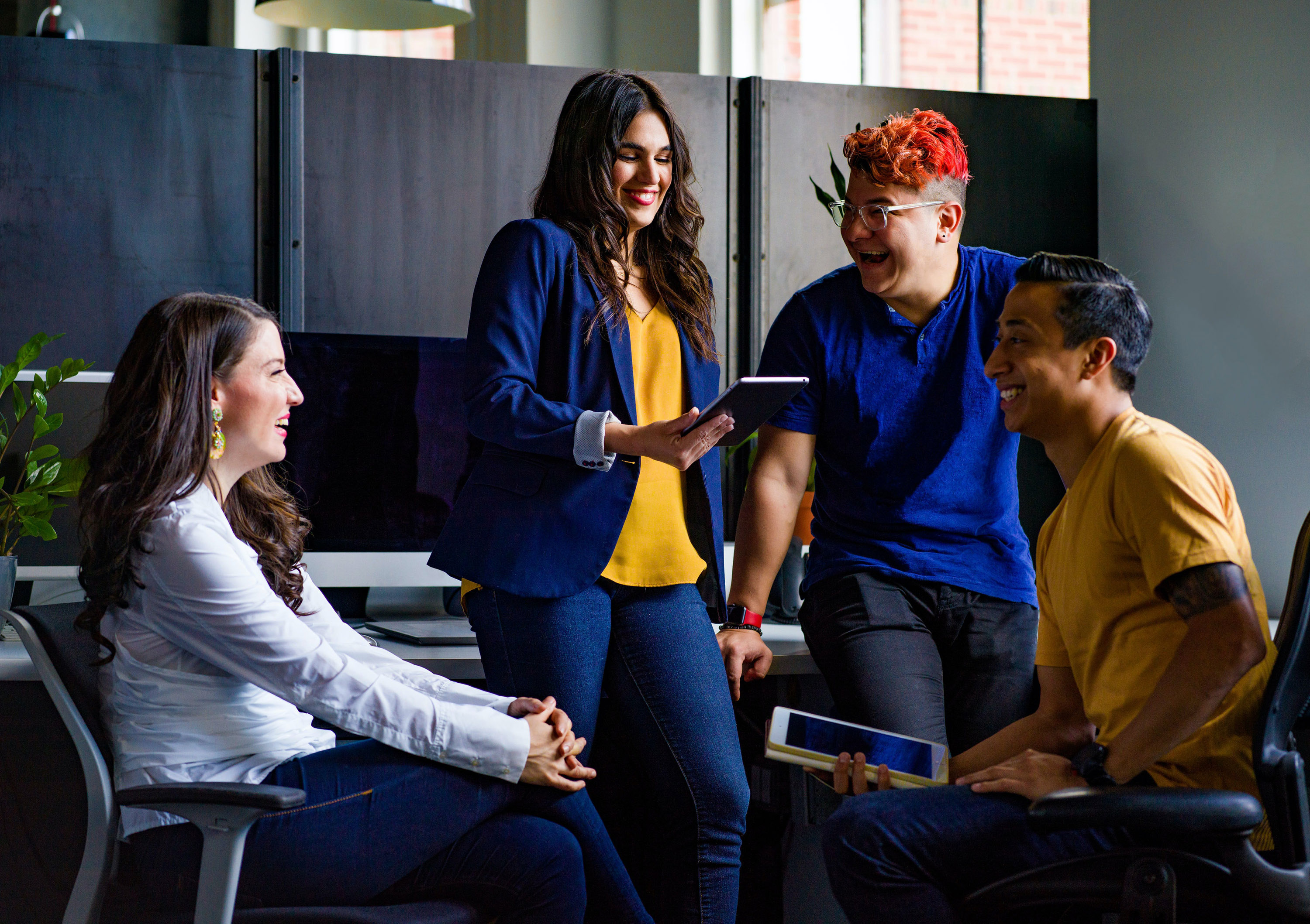 image of four college students talking to one another