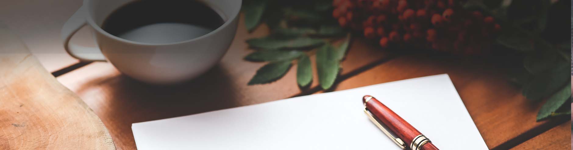 coffee cup, pen and paper